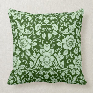 An antique floral damask throw pillow