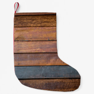 An antique wood wall texture background with metal small christmas stocking