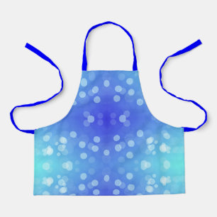 An apron with a blue and light blue polka dot 