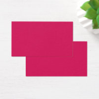 An array of red and pink flowers with lush green l
