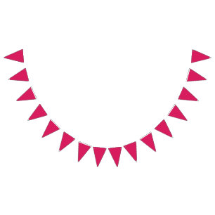An array of red and pink flowers with lush green l bunting flags