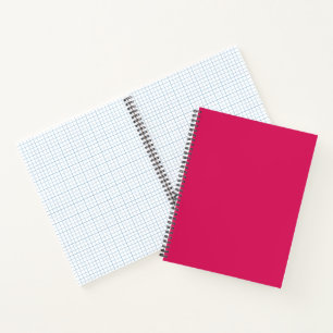 An array of red and pink flowers with lush green l notebook