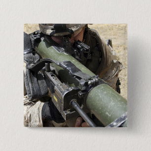 An assaultman 2 inch square button