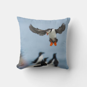 AN ATLANTIC PUFFIN COMING IN TO LAND WITH ITS WING THROW PILLOW
