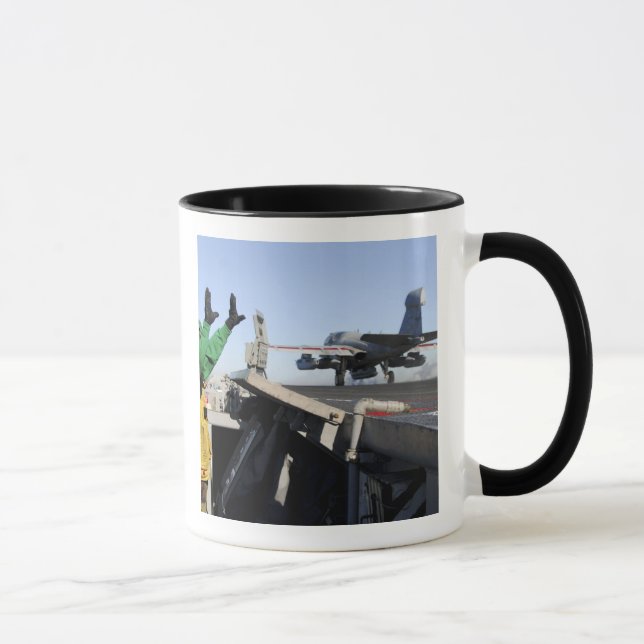 An EA-6B Prowler launches from the flight deck Mug (Right)