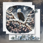An Eagle atop a Snow filled Branch Christmas Holiday Card<br><div class="desc">Personalized Christmas card. An eagle sitting on a snowy branch in a tree full of pretty twinkling white Christmas lights.</div>