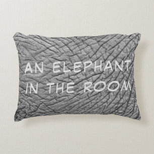 An elephant in the room skin photo with white text accent pillow