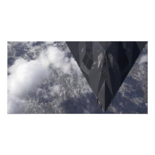 An F-117A Nighthawk flies high over the mountai Photo Print