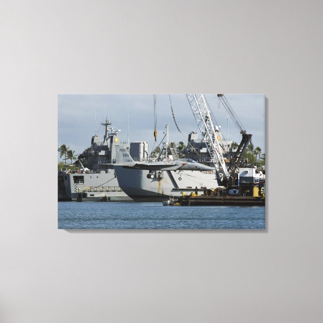 An F-15 Eagle gets a lift from a barge crane Canvas Print (Front)