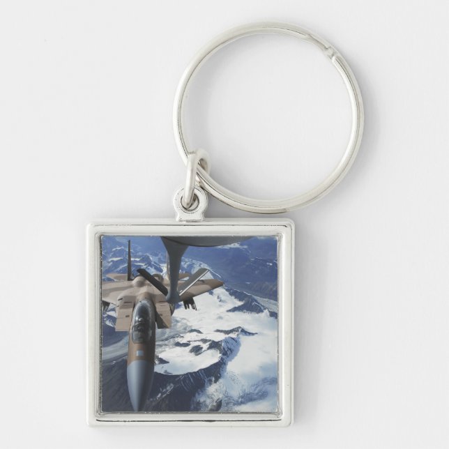 An F-15C Eagle aircraft sits behind a KC-135R Keychain (Front)