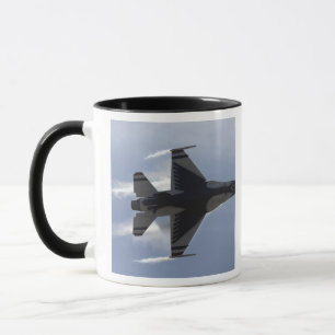 An F-16 Fighting Falcon pulls high G's Mug