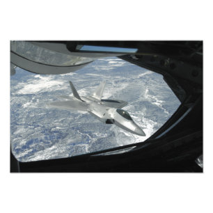 An F-22 Raptor banks away from a KC-135 Photo Print