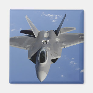 An F-22 Raptor moves into position to receive f 2 Magnet