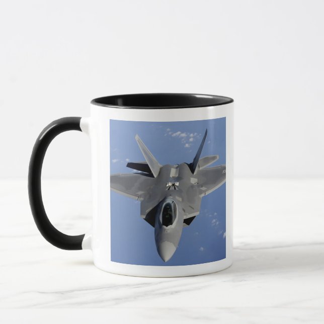 An F-22 Raptor moves into position to receive f 2 Mug (Left)