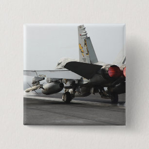 An F/A-18C Hornet launches from the flight deck 2 Inch Square Button