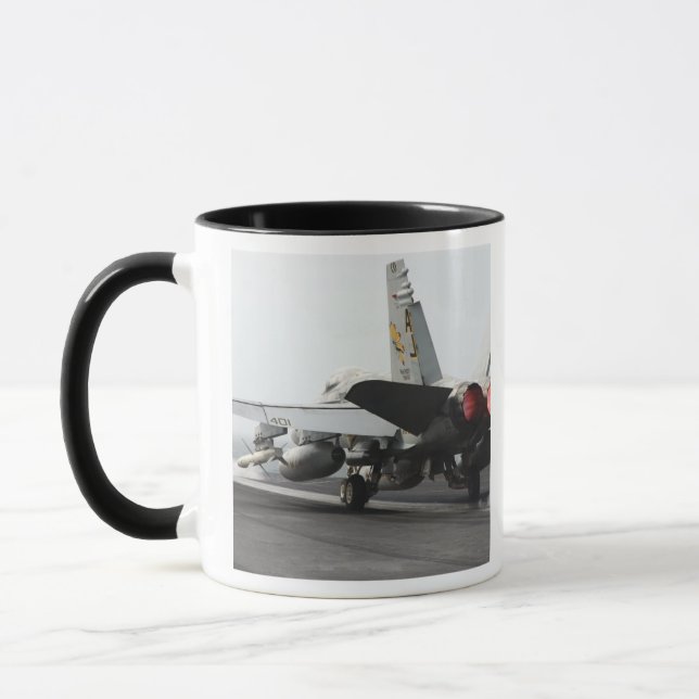 An F/A-18C Hornet launches from the flight deck 2 Mug (Left)