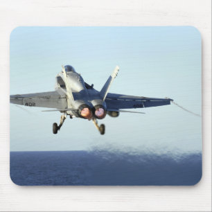 An F/A-18C Hornet launches from the flight deck Mouse Pad