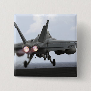 An F/A-18E Super Hornet launches 2 Inch Square Button