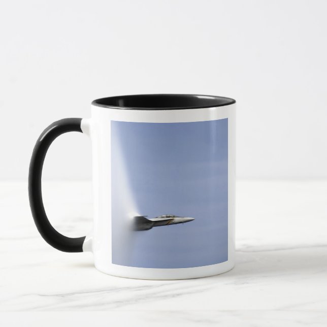 An F/A-18E Super Hornet reaches the speed of so Mug (Left)