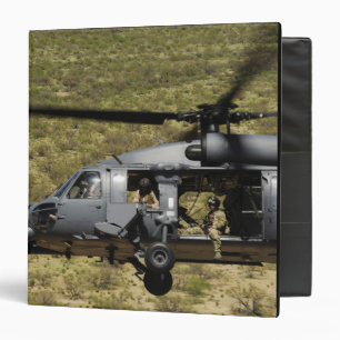 An HH-60 Pave Hawk flies over the desert Binder