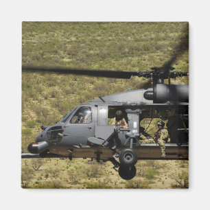 An HH-60 Pave Hawk flies over the desert Magnet