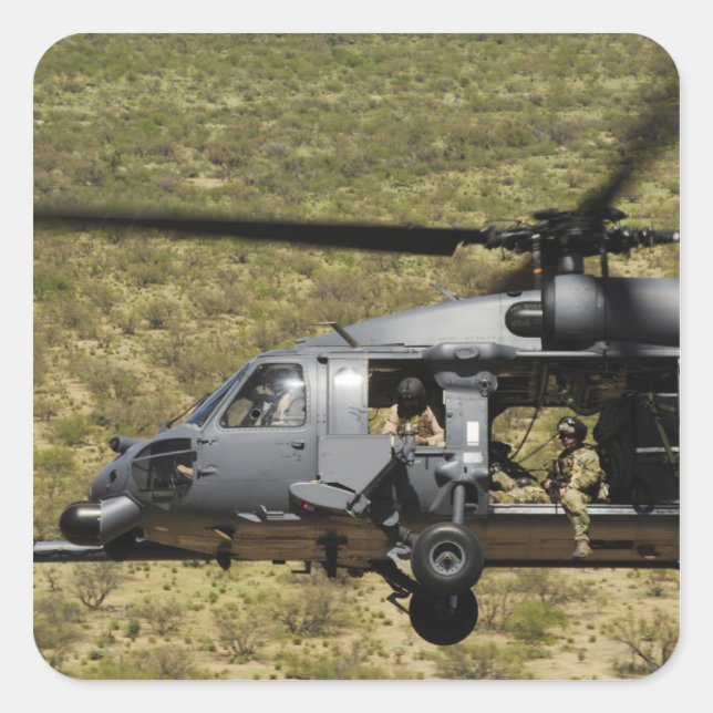 An HH-60 Pave Hawk flies over the desert Square Sticker (Front)