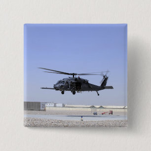 An HH-60G Pave Hawk taking off from Camp Bastio 2 Inch Square Button