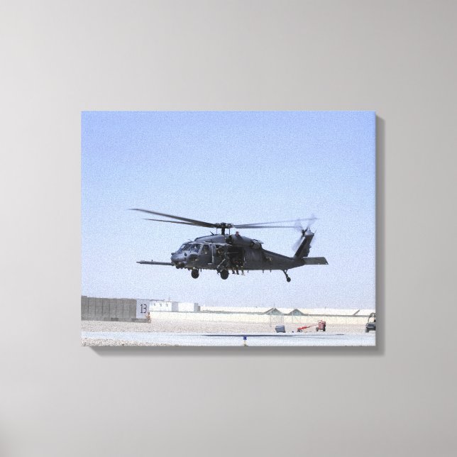 An HH-60G Pave Hawk taking off from Camp Bastio Canvas Print (Front)