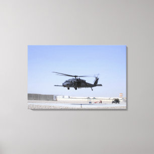 An HH-60G Pave Hawk taking off from Camp Bastio Canvas Print