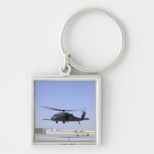 An HH-60G Pave Hawk taking off from Camp Bastio Keychain