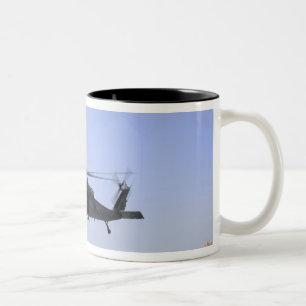 An HH-60G Pave Hawk taking off from Camp Bastio Two-Tone Coffee Mug
