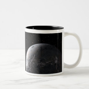 An icy/rocky planet orbiting a dim star Two-Tone coffee mug