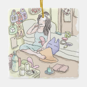 an illustration of a woman sitting in a messy bedr ceramic ornament