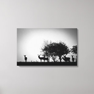 An image of some deer in the morning mist canvas print