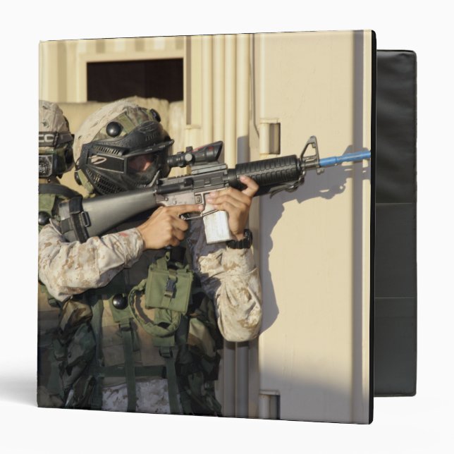 An infantry scout aims his weapon binder (Front/Inside)