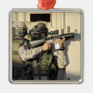 An infantry scout aims his weapon metal ornament