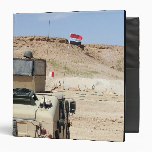 An instructor watches as an Iraqi army soldier Binder (Front/Inside)