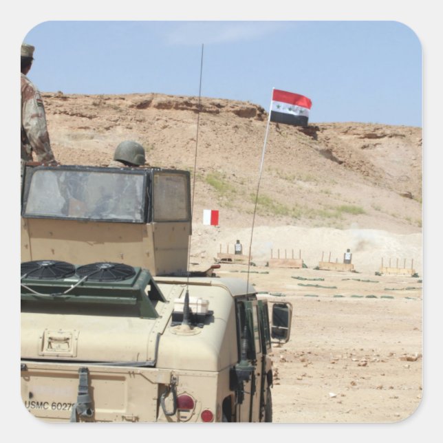 An instructor watches as an Iraqi army soldier Square Sticker (Front)