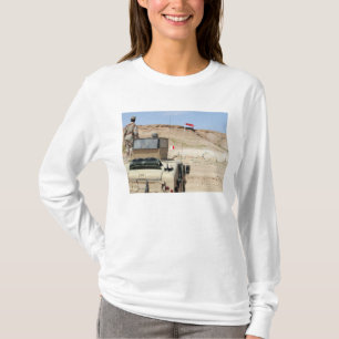 An instructor watches as an Iraqi army soldier T-Shirt