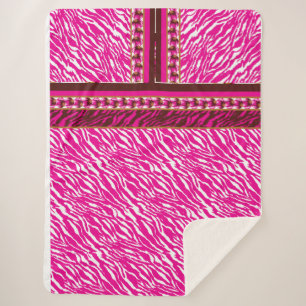 An intricate floral pattern in pink and white, art sherpa blanket