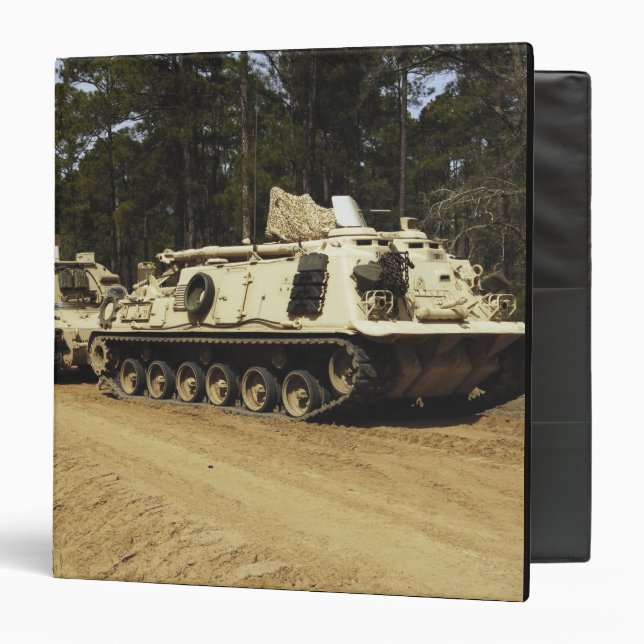 An M-88 recovery vehicle begins to tow an M992 Binder (Front/Inside)