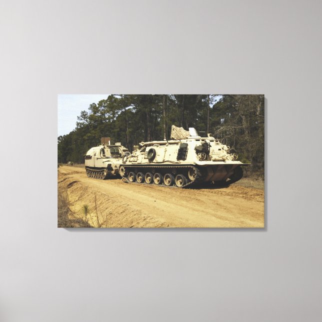 An M-88 recovery vehicle begins to tow an M992 Canvas Print (Front)