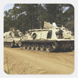 An M-88 recovery vehicle begins to tow an M992 Square Sticker