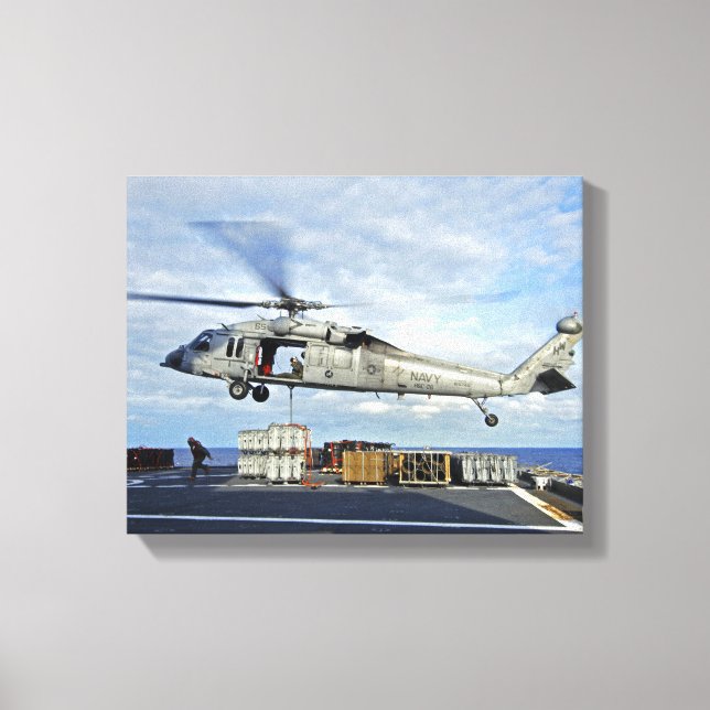 An MH-60S Seahawk prepares to deliver ammunitio Canvas Print (Front)