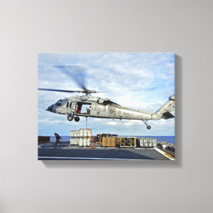 An MH-60S Seahawk prepares to deliver ammunitio Canvas Print