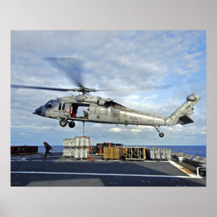 An MH-60S Seahawk prepares to deliver ammunitio Poster