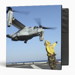 An MV-22 Osprey launches from the USS Nassau Binder