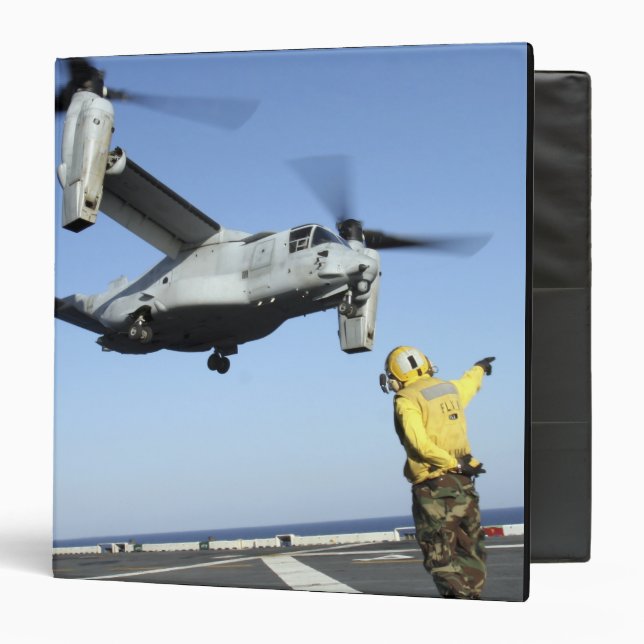 An MV-22 Osprey launches from the USS Nassau Binder (Front/Inside)