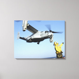 An MV-22 Osprey launches from the USS Nassau Canvas Print
