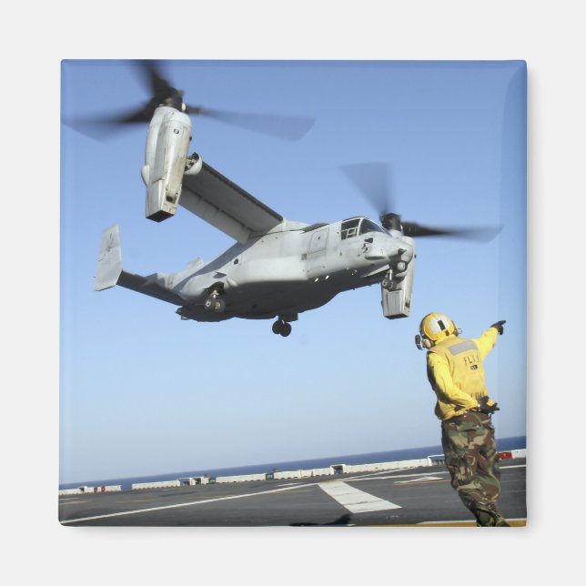 An MV-22 Osprey launches from the USS Nassau Magnet (Front)